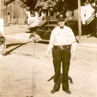 May 1947 photo by Robert McLaughlin shows Delta Borough police officer Clarence Morris on Main Street near Creamery Avenue